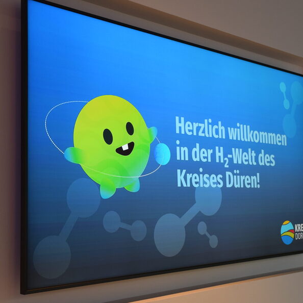 Bildschirm mit "Herzlich willkommen in der H2-Welt des Kreises Düren"