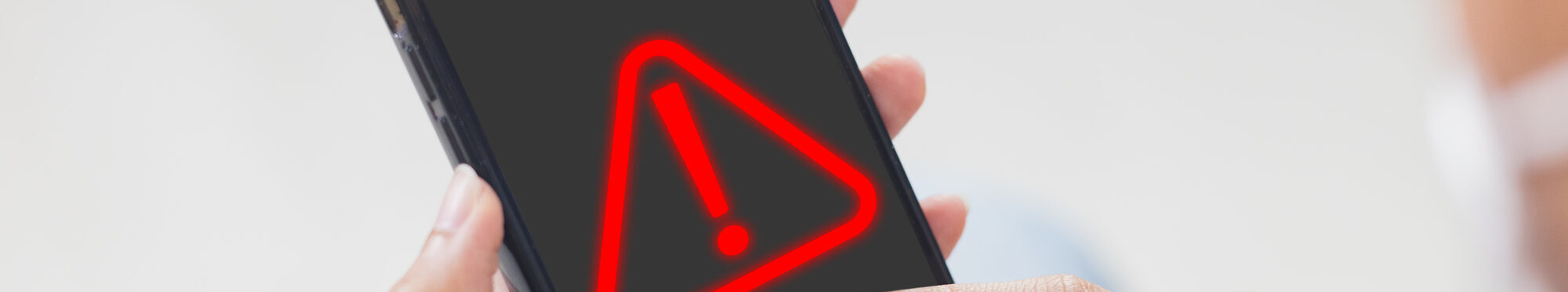 woman using smartphone with notification error. warning sign over on mobile phone. maintenance connection application. programmer, developer. security network dangerous.