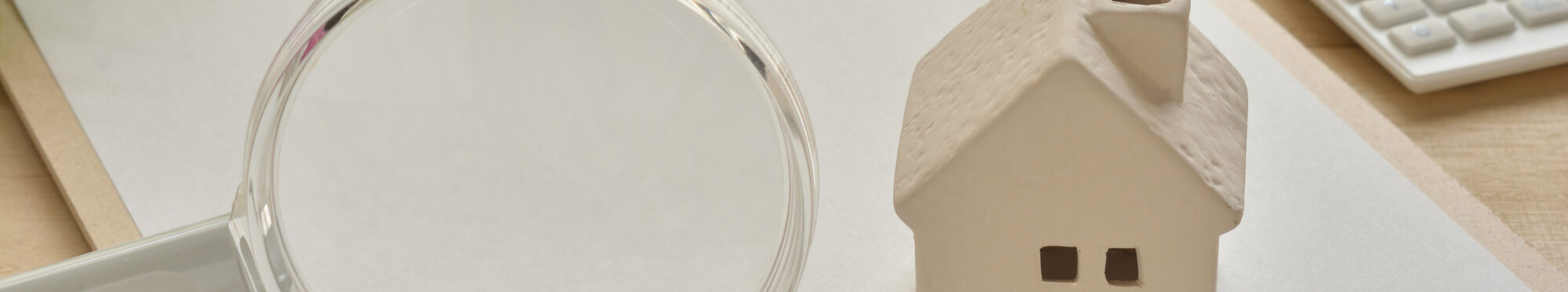 Magnifying glass and house